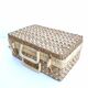 Suitcase in rattan and woven wicker