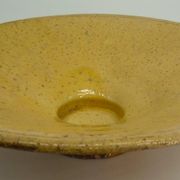 Old omelette turner, glazed yellow terracotta, south of France.