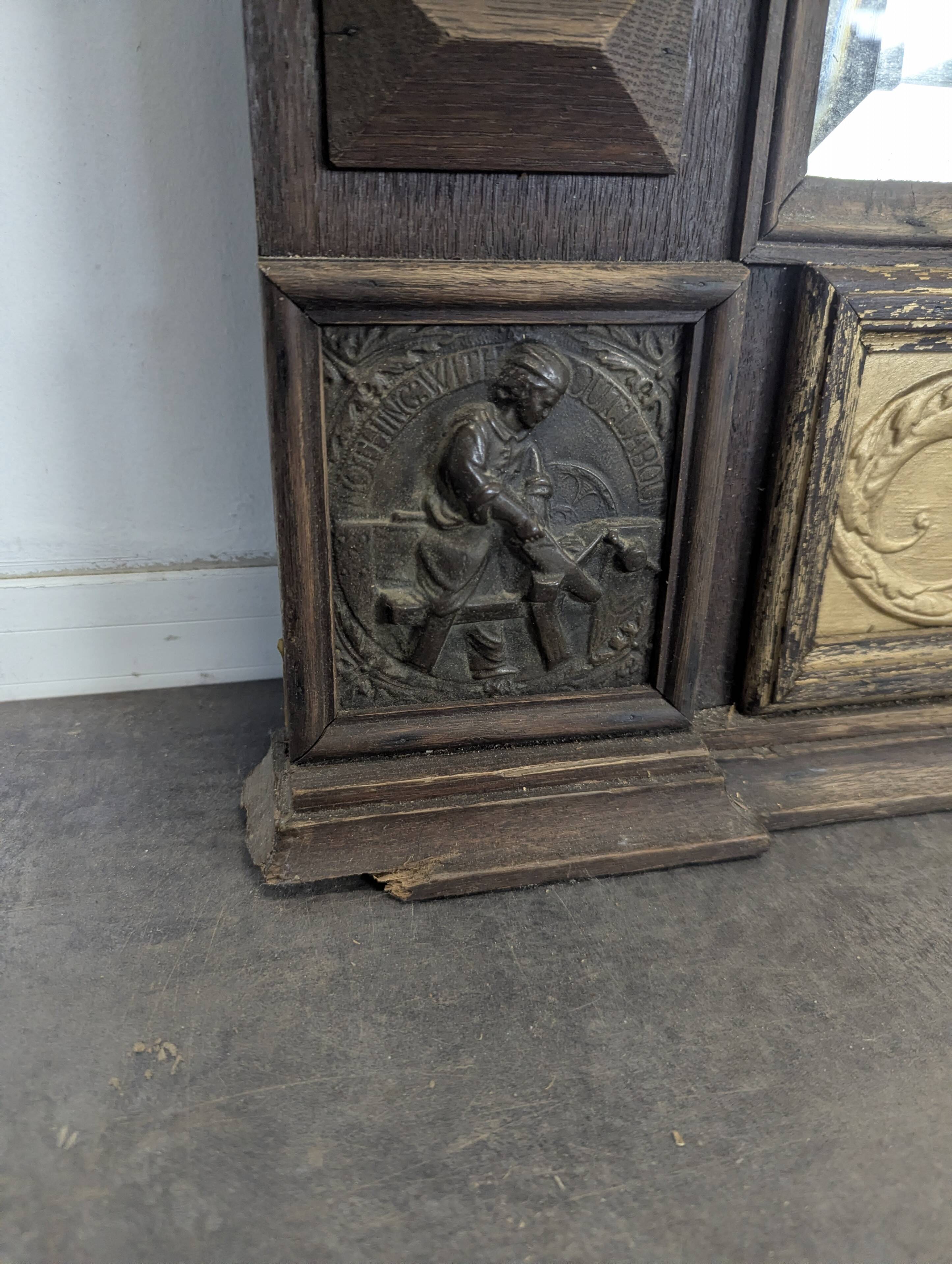 Renaissance-style mirror in wood and copper with a craftsmanship theme.