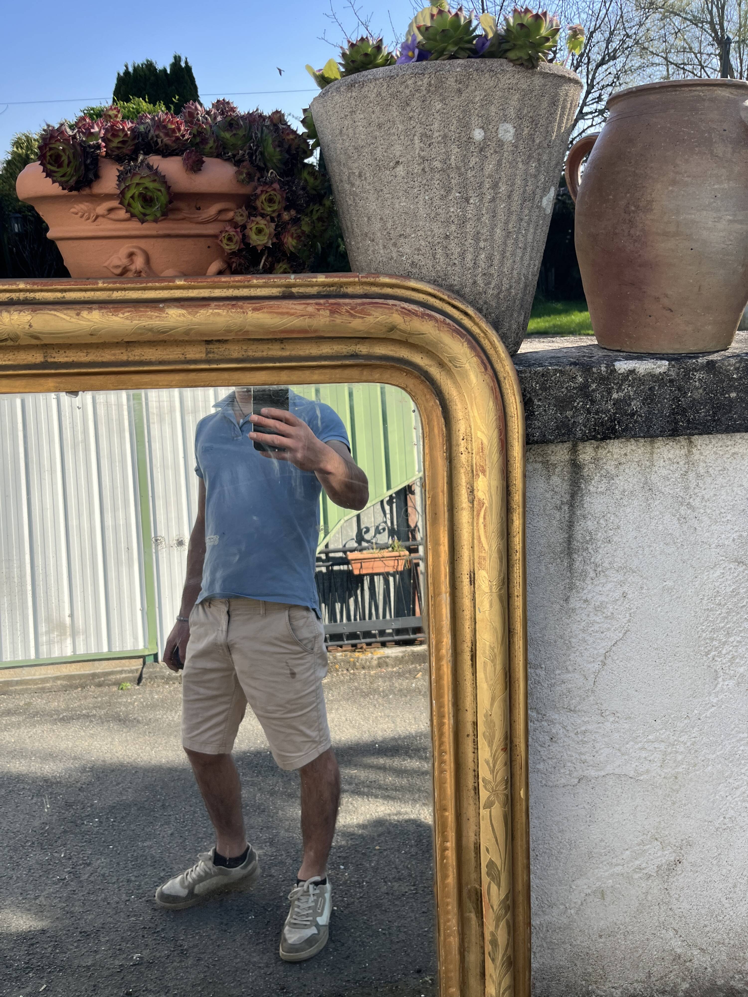 Large Louis-Philippe gilded mirror with gold leaf