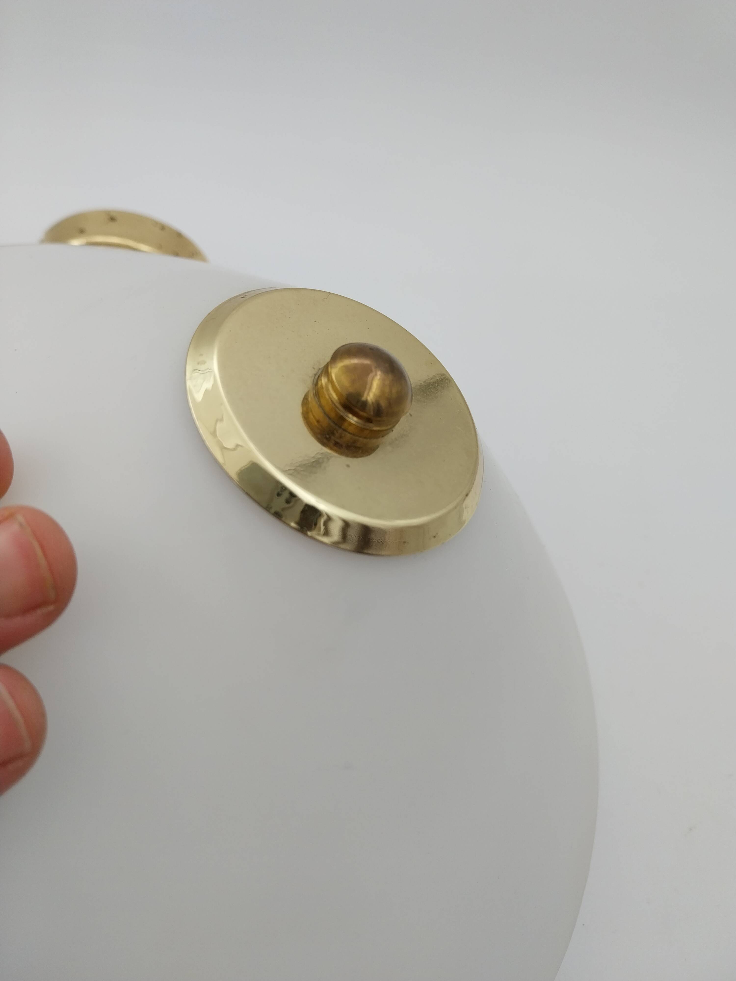 Pair of articulated arm wall lights in brass with opaline globe