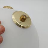 Pair of articulated arm wall lights in brass with opaline globe