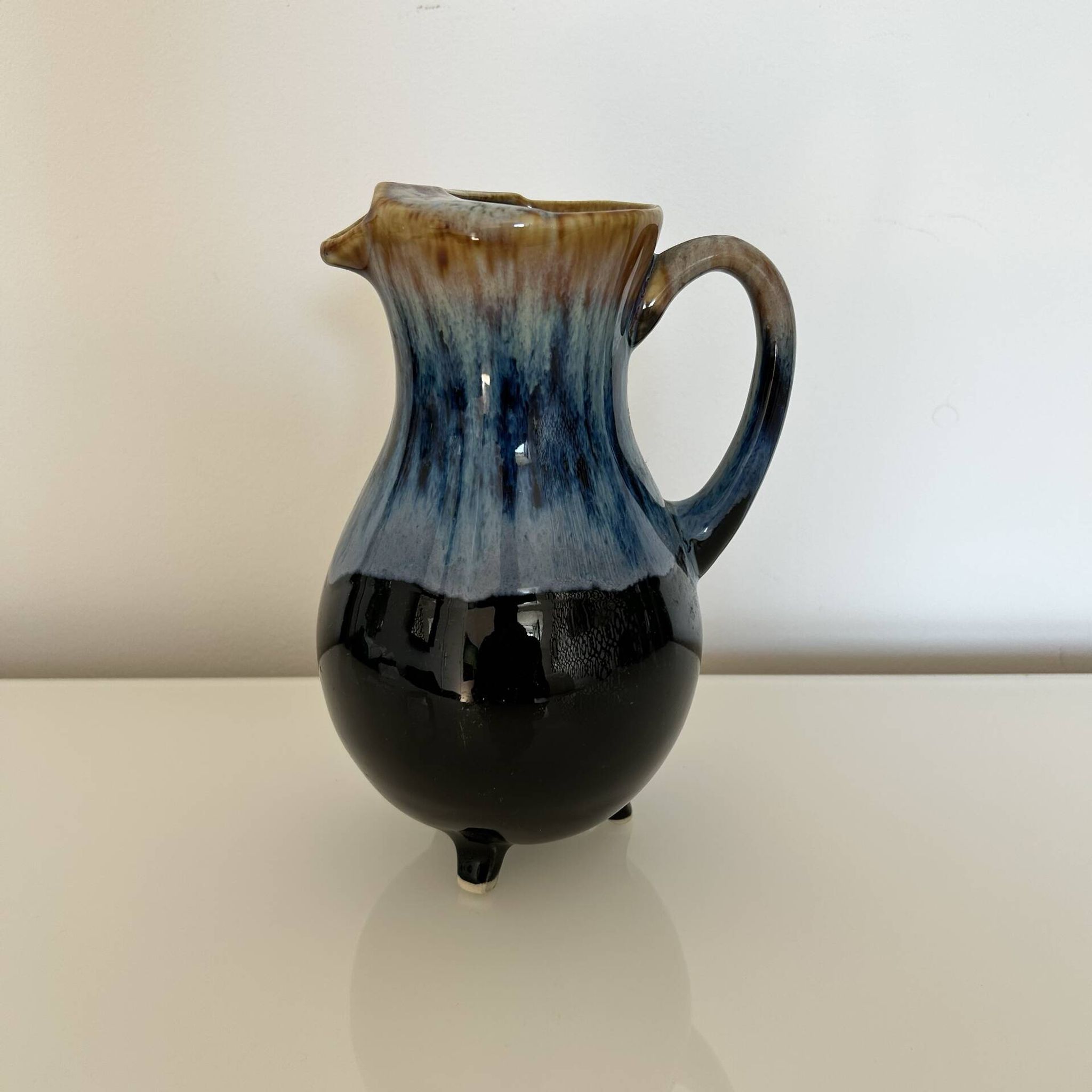 Flamed blue tripod jug