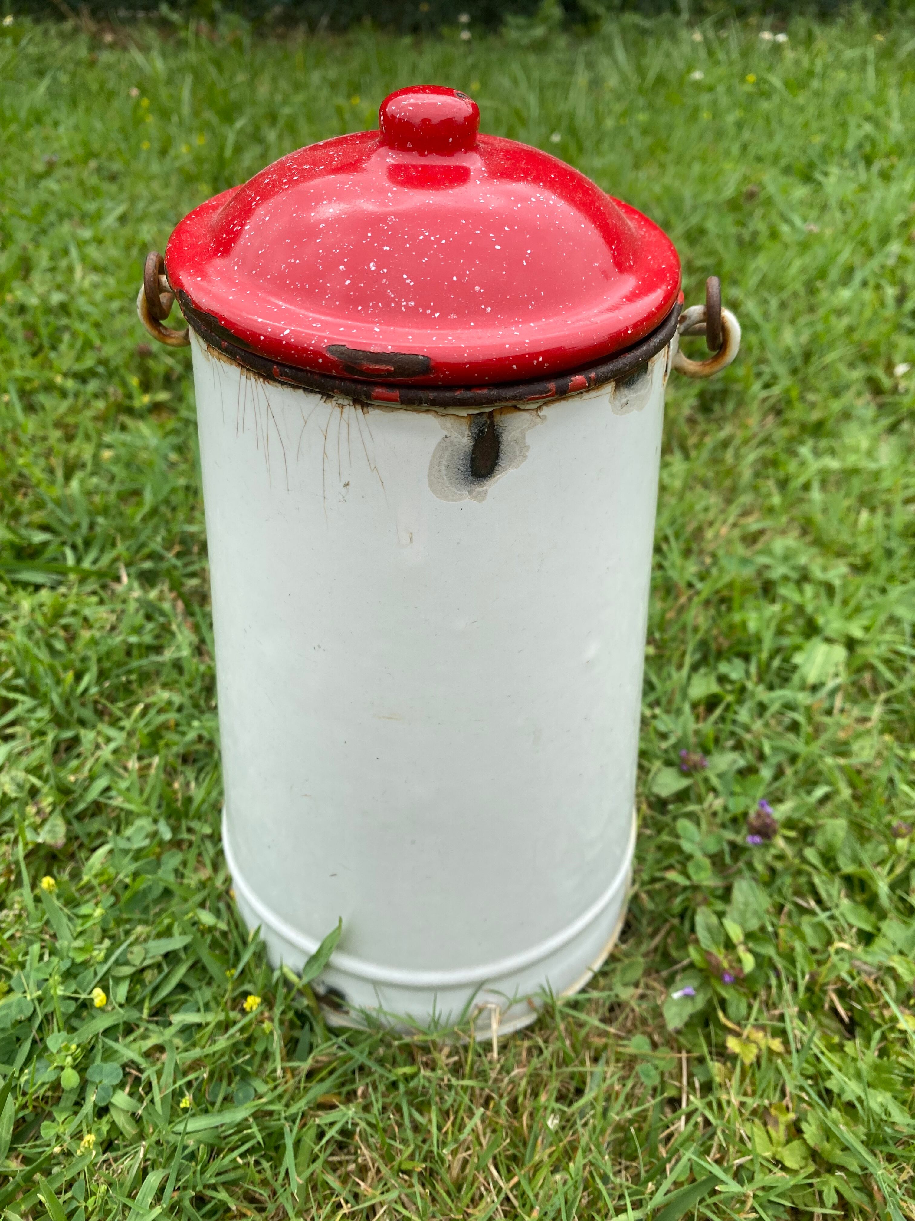 Old milk pot in enamelled sheet metal