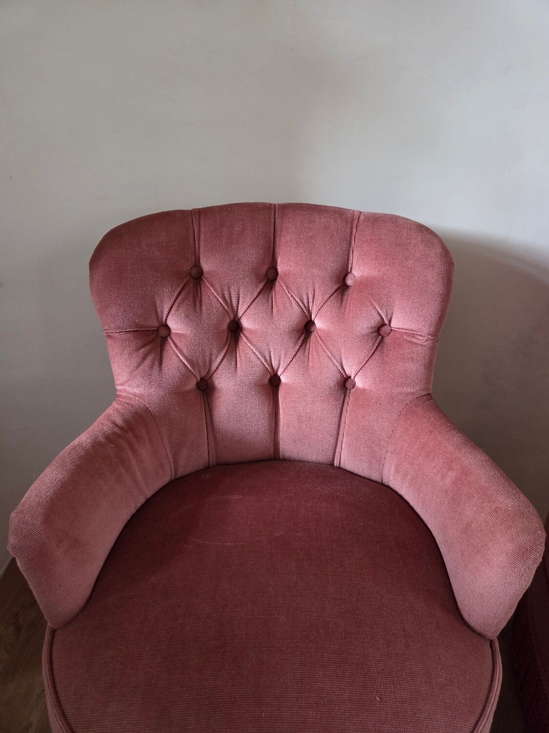 A pair of small tub chairs.