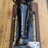 Old Singer sewing machine on its original base