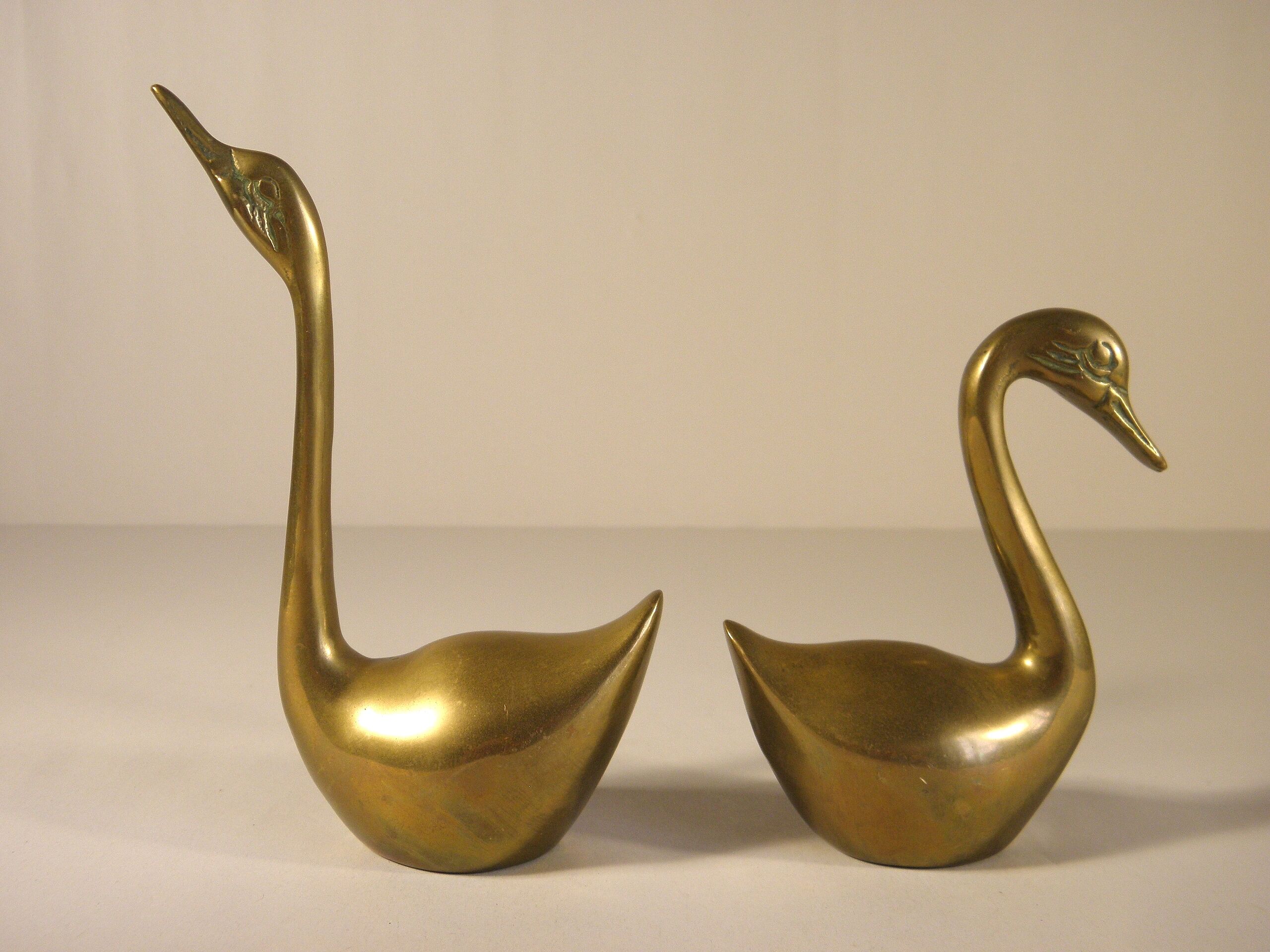Pair of brass swans