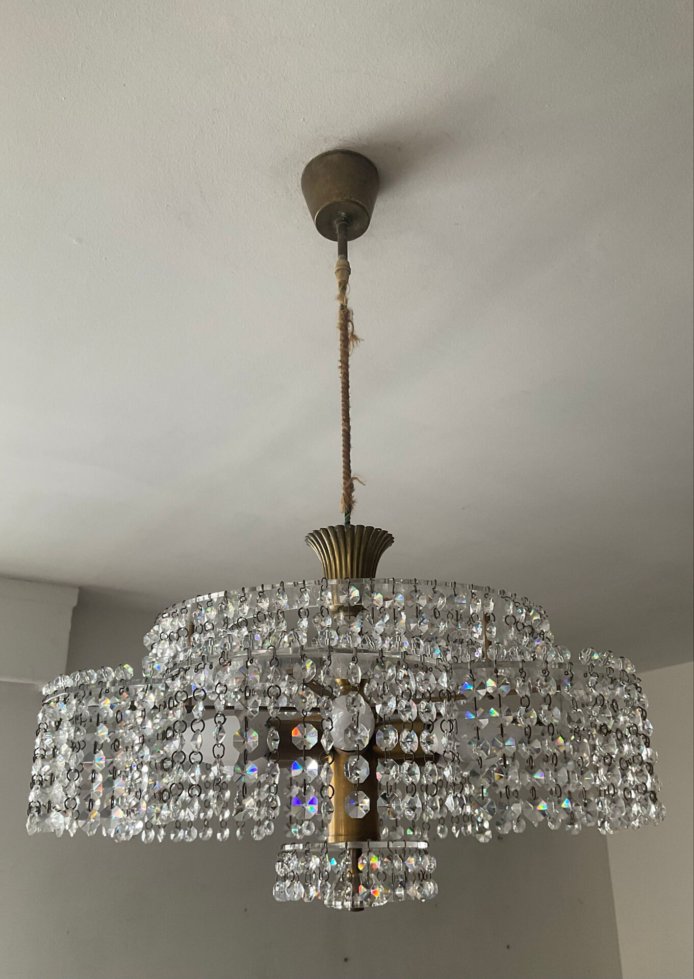 Vintage lucite chandelier with a cascade of crystal pendants from the 1970s.