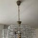 Vintage lucite chandelier with a cascade of crystal pendants from the 1970s.