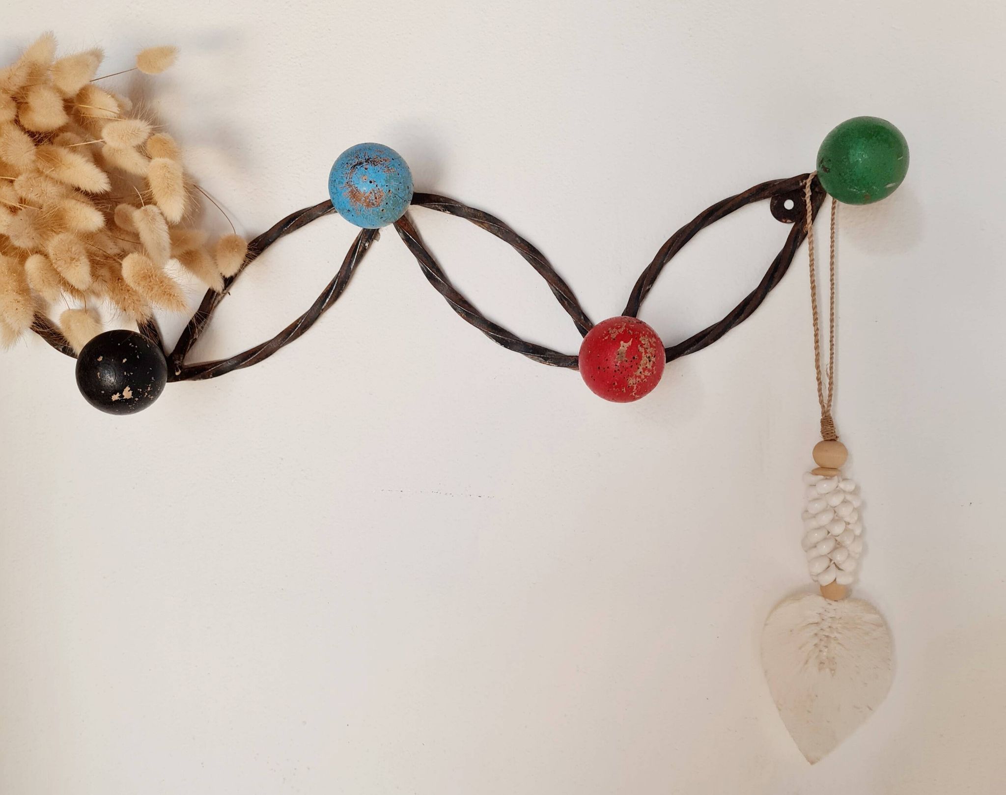 Vintage wall-mounted coat rack in wrought iron with coloured balls - Roger Feraud