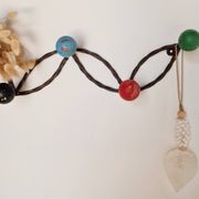 Vintage wall-mounted coat rack in wrought iron with coloured balls - Roger Feraud