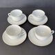 Set of 4 porcelain cups and sub-cups