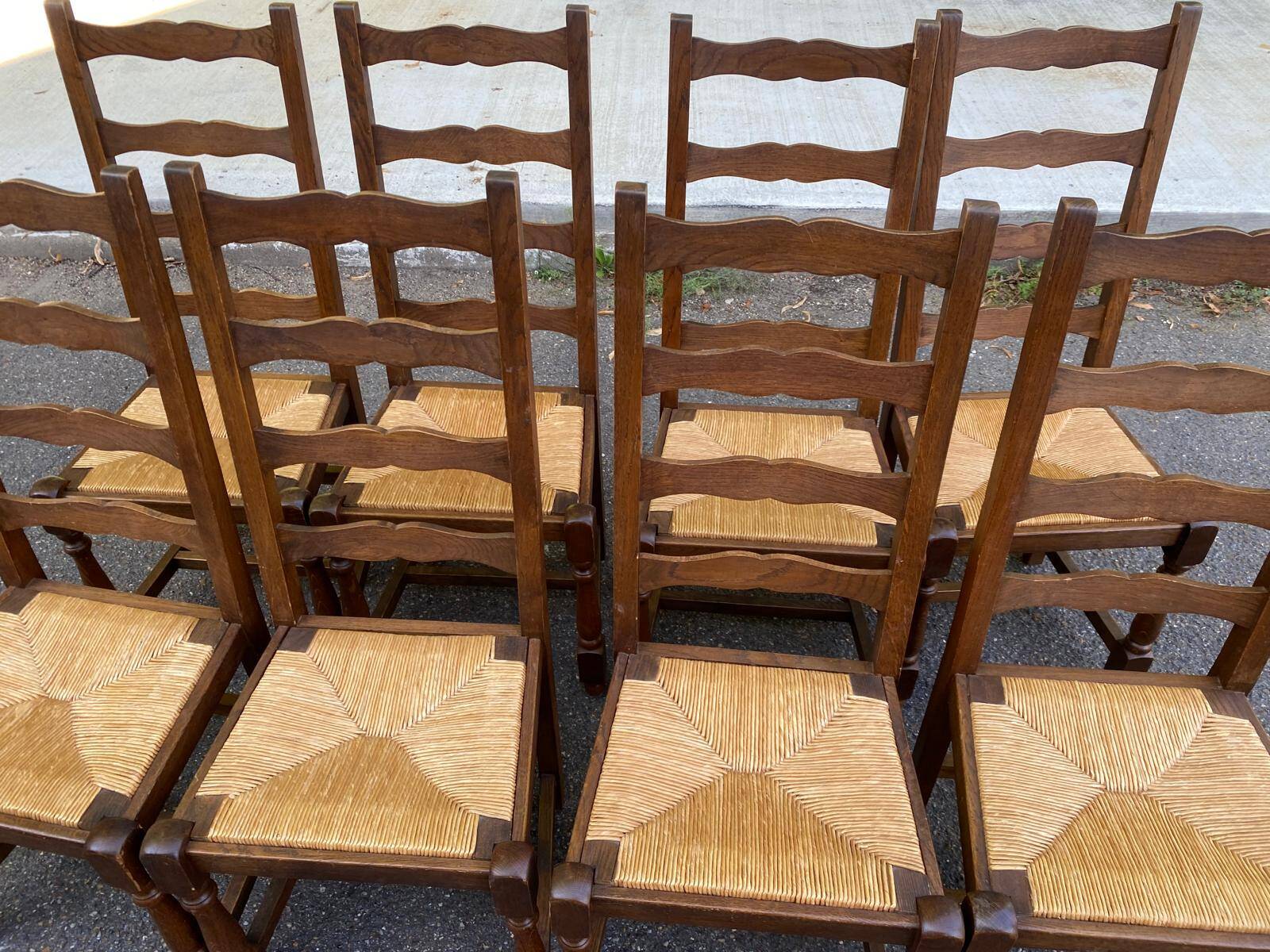 8 solid oak chairs in medium oak with straw, farmhouse style, high back.