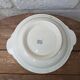 Shallow round plate Boch Frères model Regent with arabesque and foliage decoration.