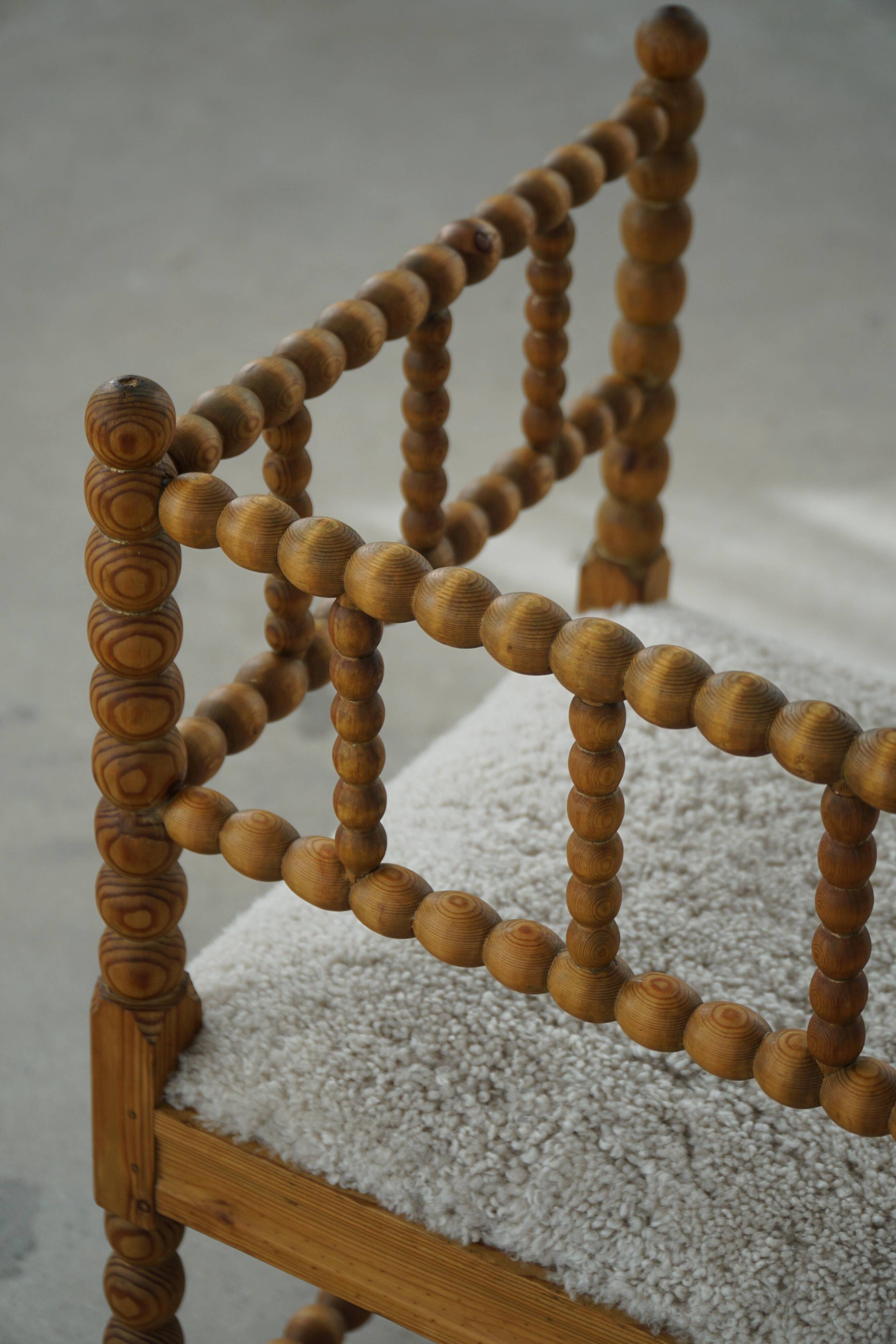 Antique French corner chair handcrafted with lamb's wool, early 20th century.