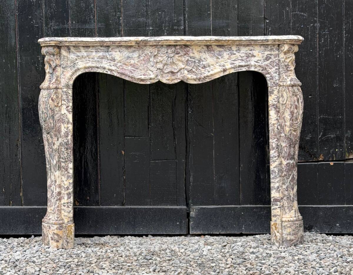 Louis XV style fireplace in Brocatelle marble, circa 1880.