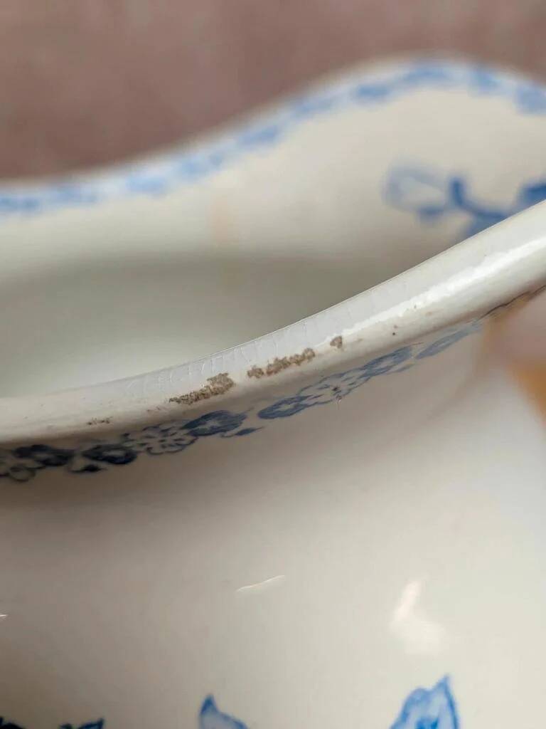 Small antique ironstone jug L.m Creil and Montereau with blue floral decoration.