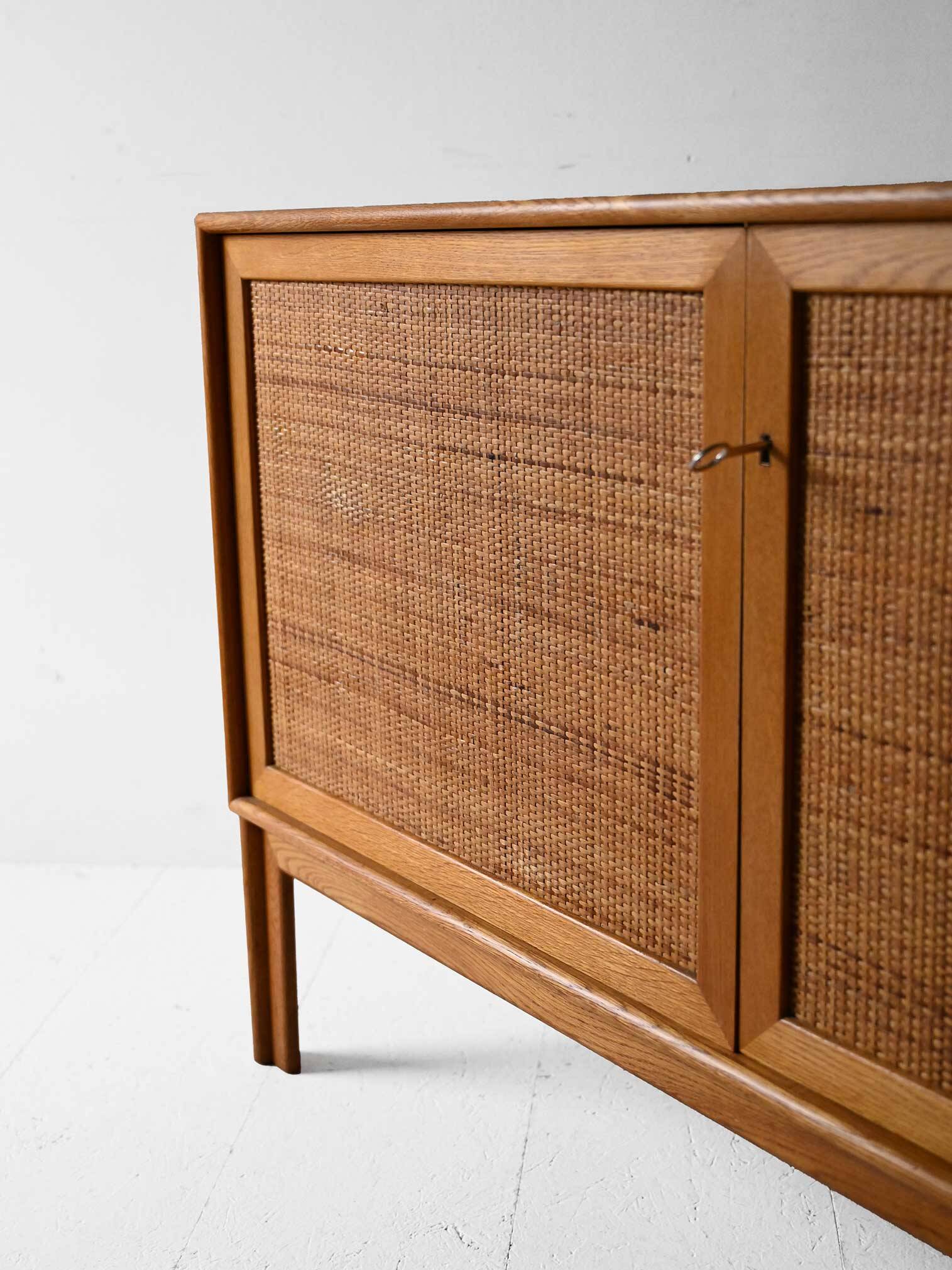 Scandinavian oak cabinet with woven rattan doors