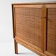 Scandinavian oak cabinet with woven rattan doors