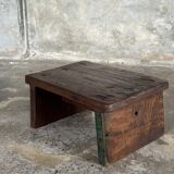 Small auxiliary stool in upcycled teak with traces of green chrome on the leg.