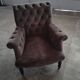 Buttoned armchair