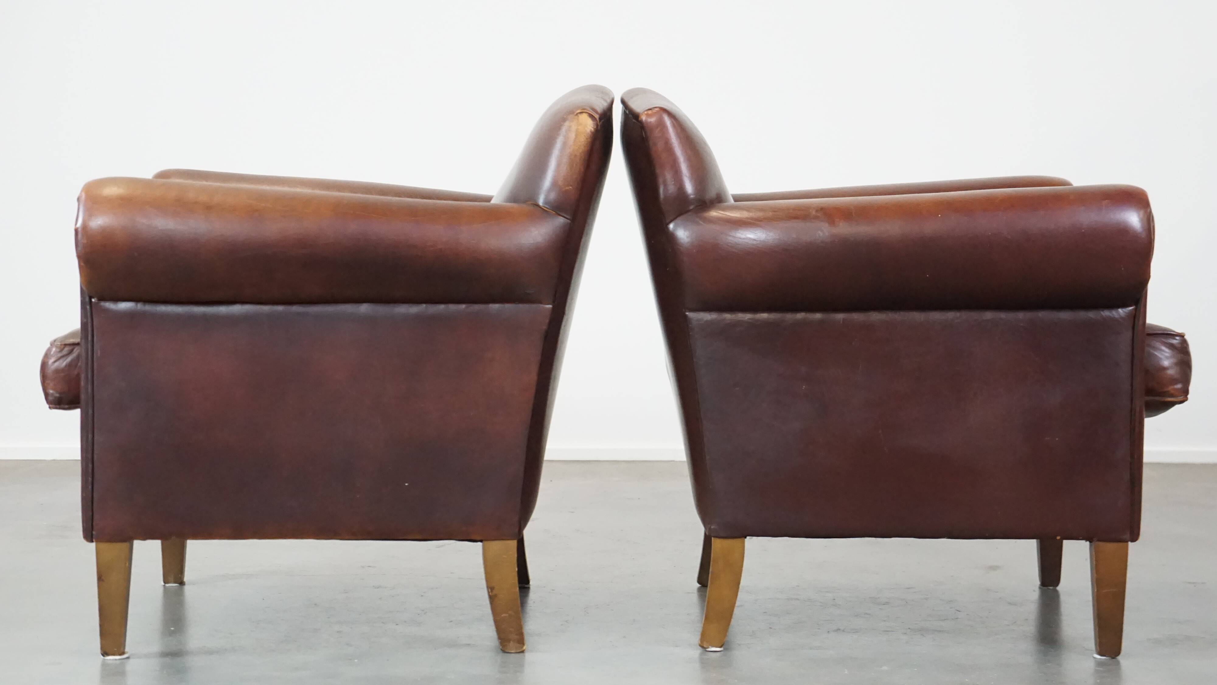 Set of 2 design armchairs made of sheepskin