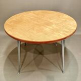 High table in solid raw wood and cast aluminum.
