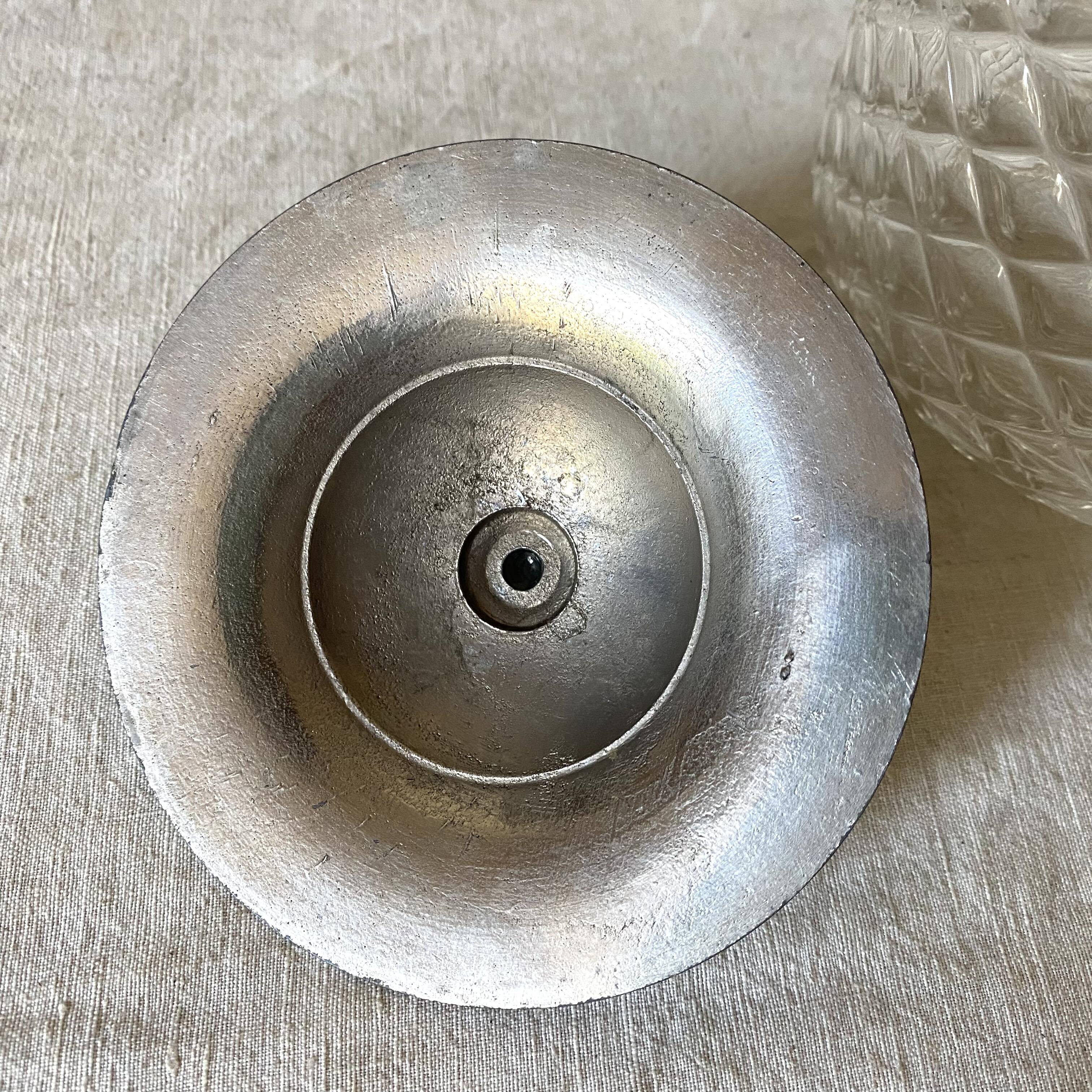 Old biscuit bucket in glass and metal