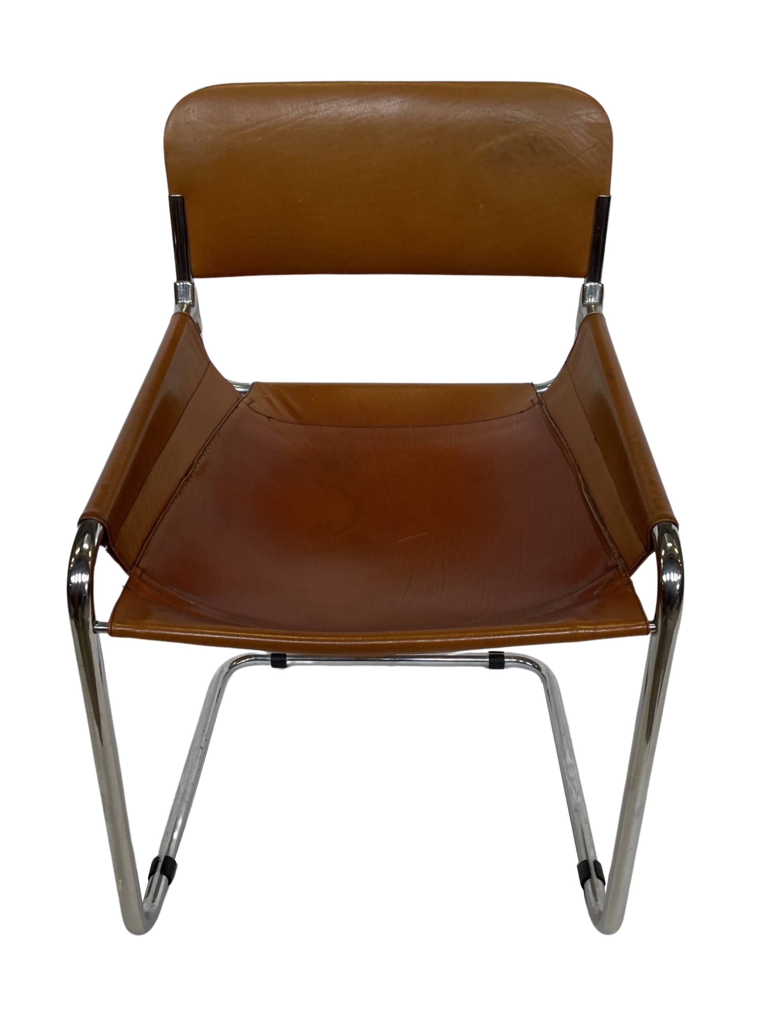 vintage dining room chair in cognac leather and chrome 1970s Italy