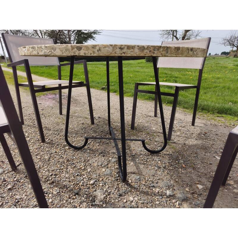 Garden furniture in stone with a vintage 1970s iron base.