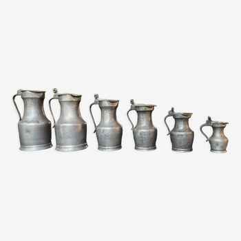 Series of 6 antique pewter pitchers