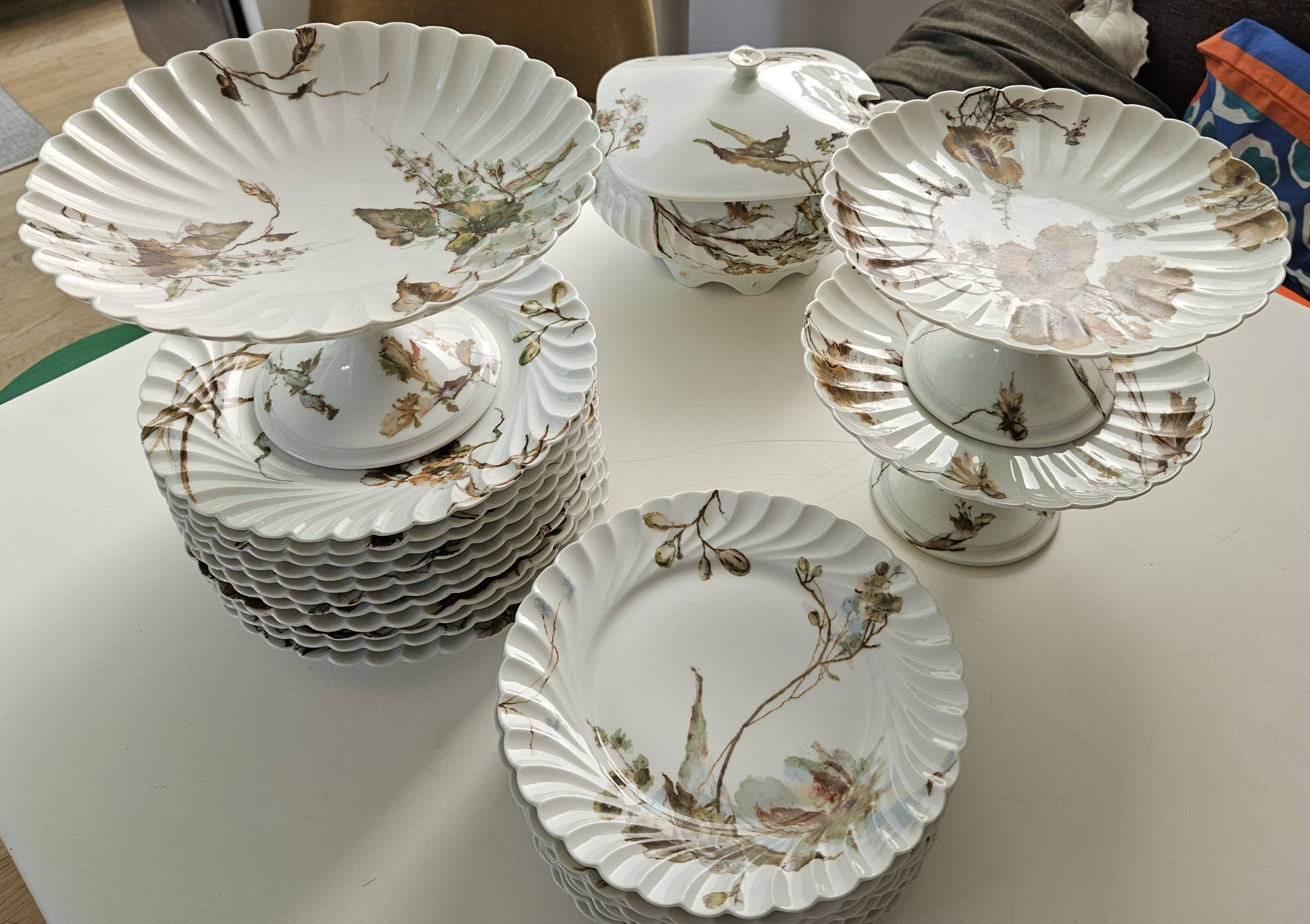 Haviland service plates, dishes on pedestals and soup tureen