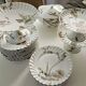 Haviland service, plates, pedestal dishes and soup tureen.