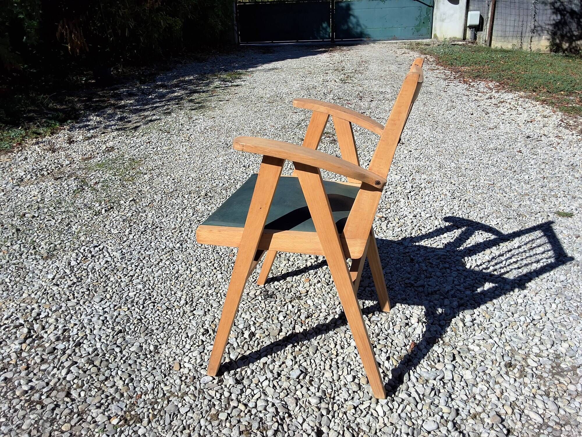 Compass leg armchair