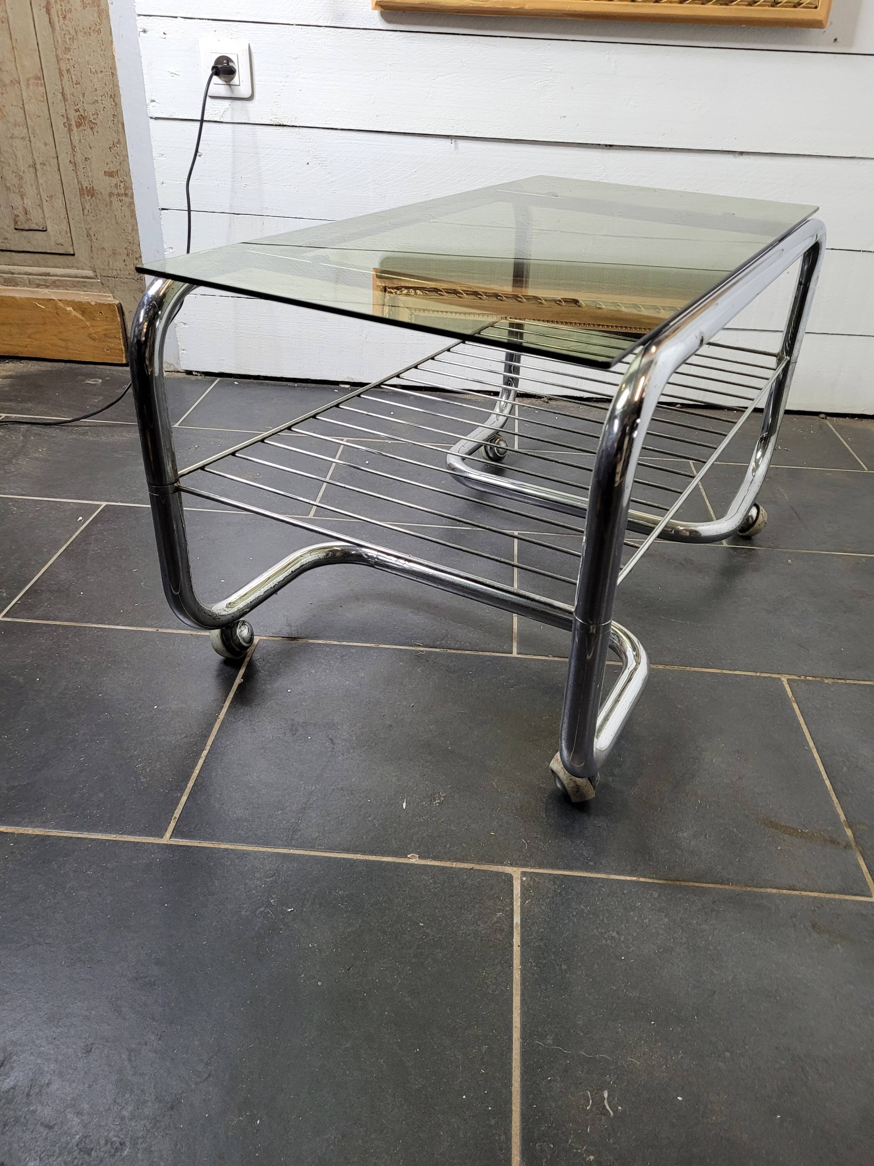 Coffee table with chrome base and smoked glass from the 70s