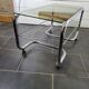 Coffee table with chrome base and smoked glass from the 70s