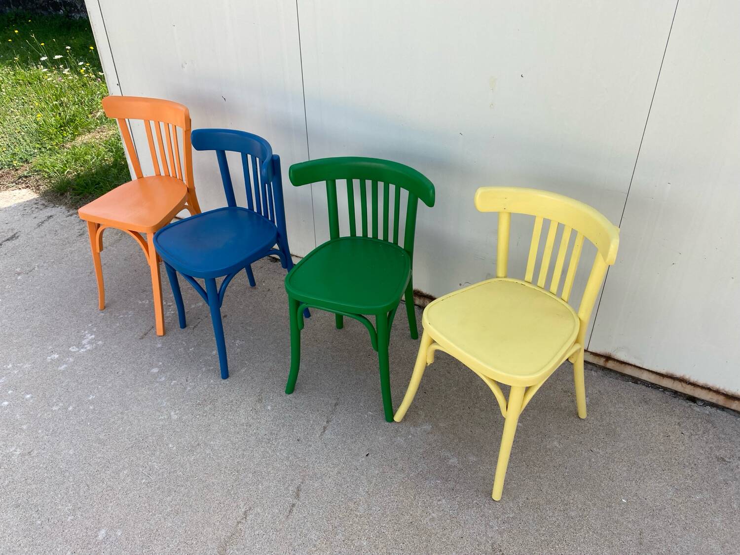 4 multi-colored bistro chairs