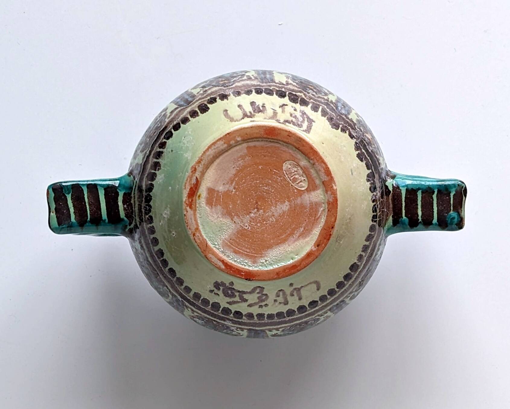 Polychrome ceramic vase in flowing enamel from Nabeul with mihrab decoration.
