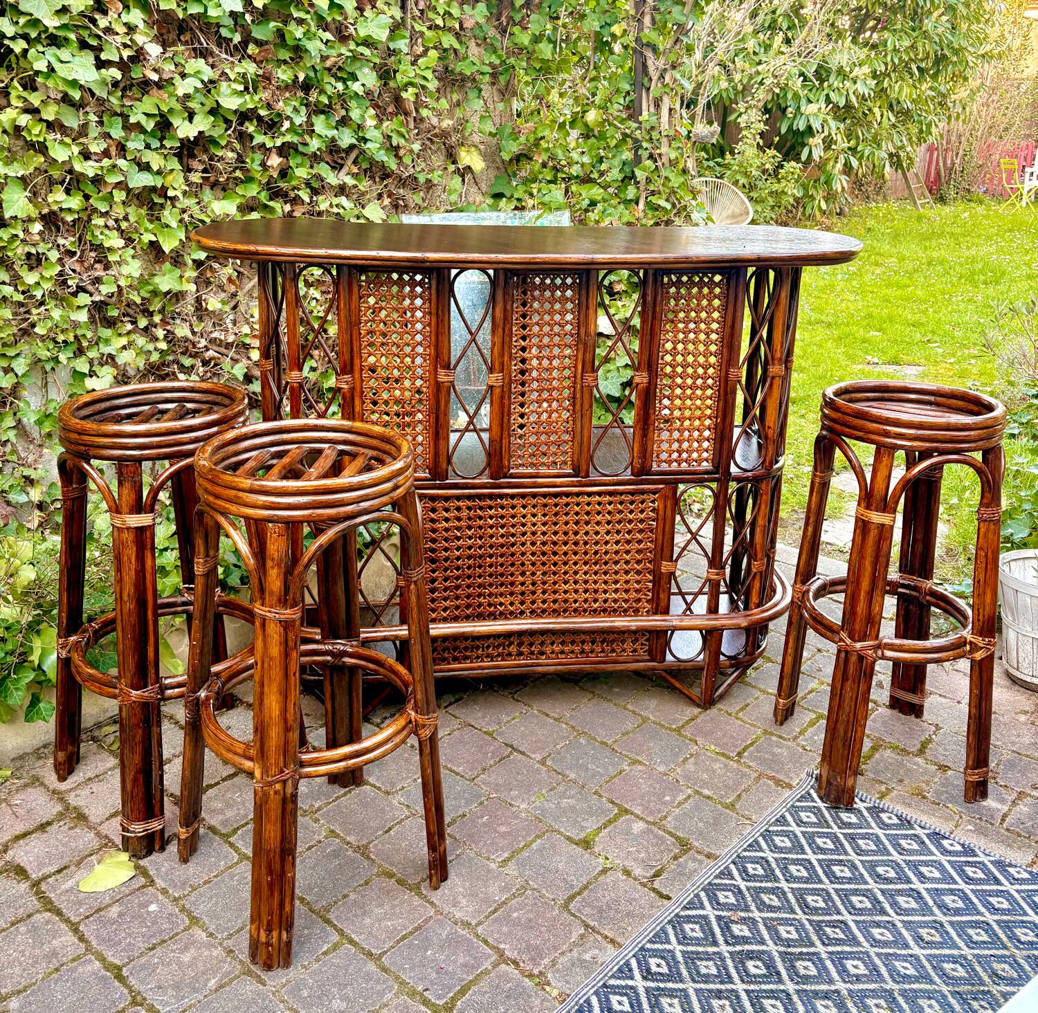 Rattan bar and vintage stools