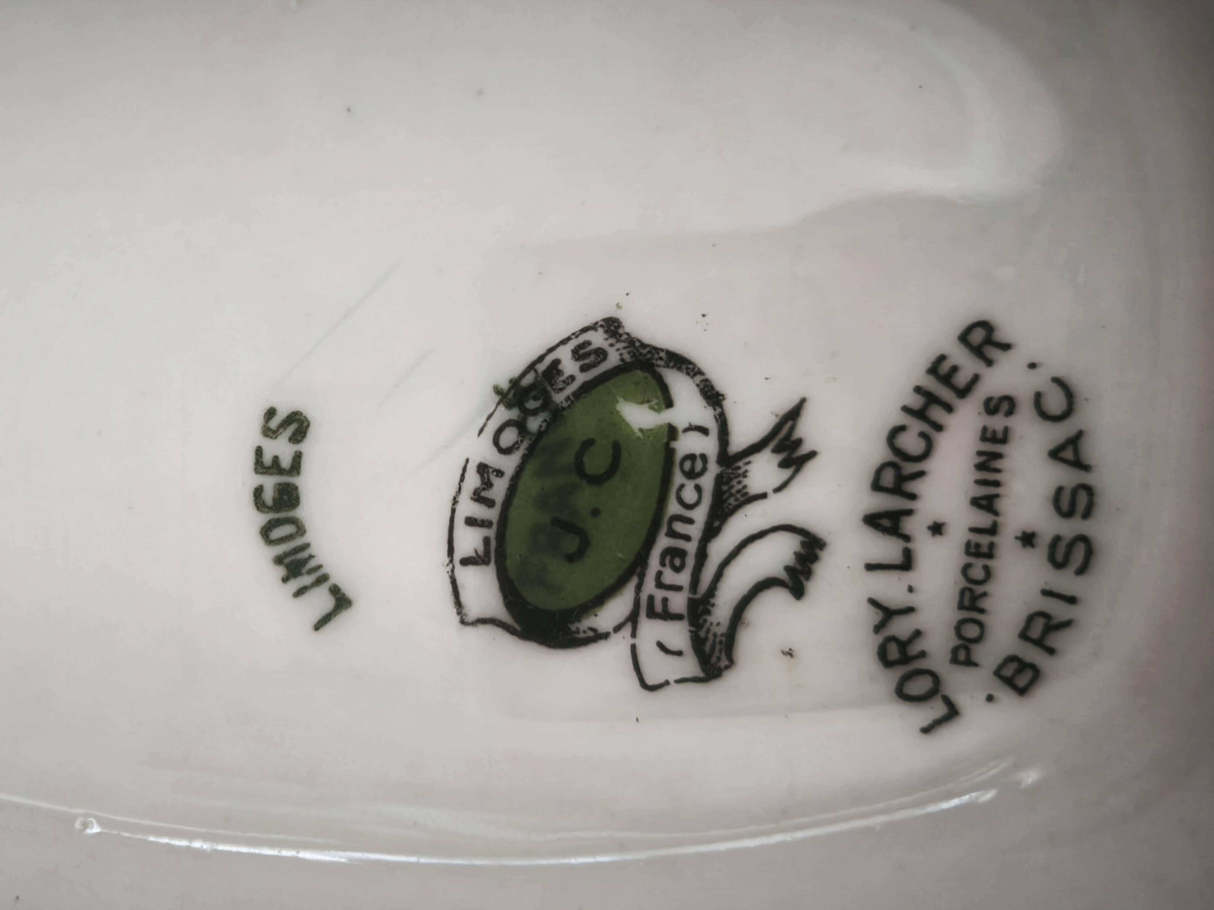 Sauce boat on a Limoges porcelain base with a hydrangea basket design.