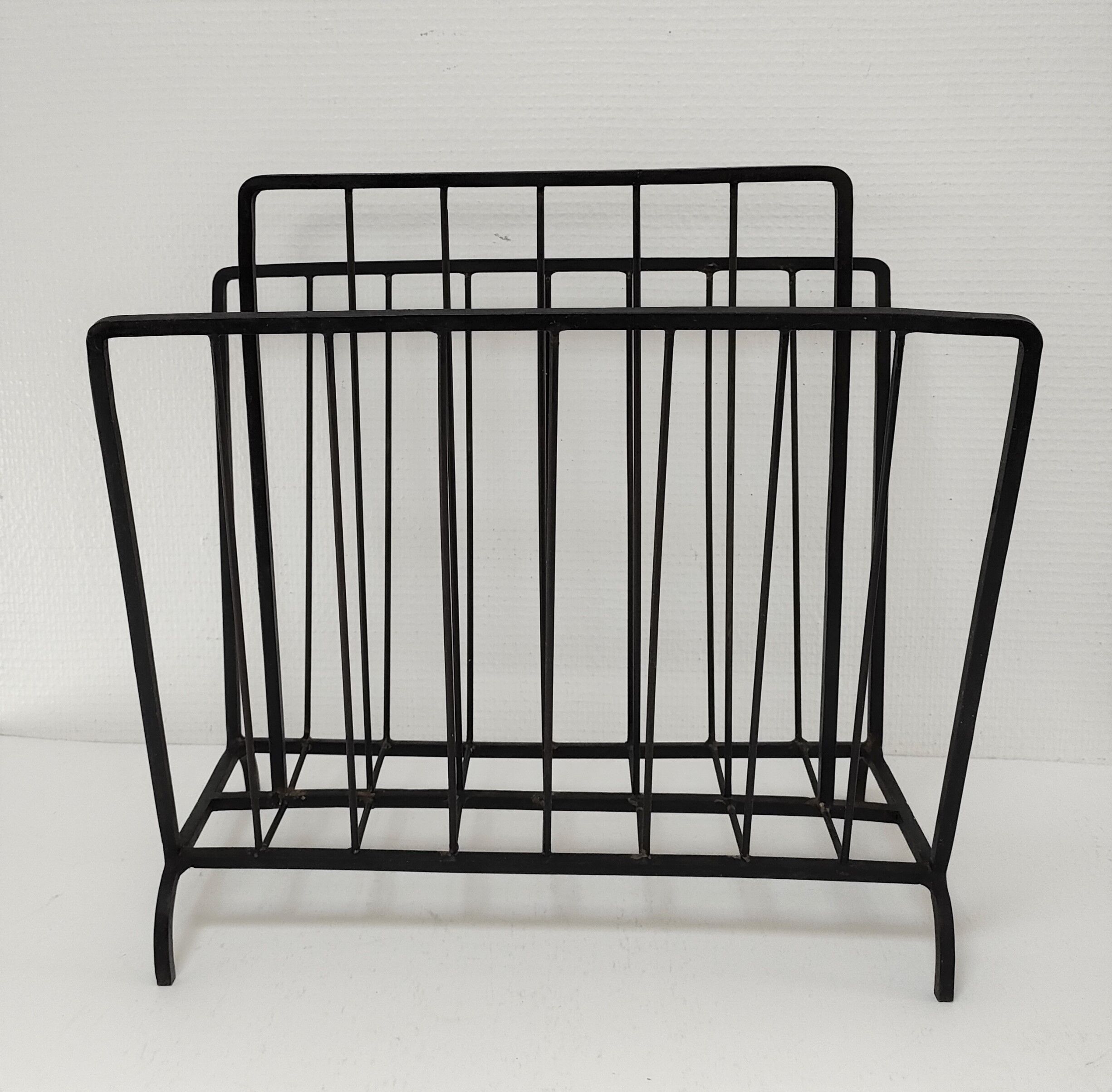 Modernist magazine holder black iron 60s