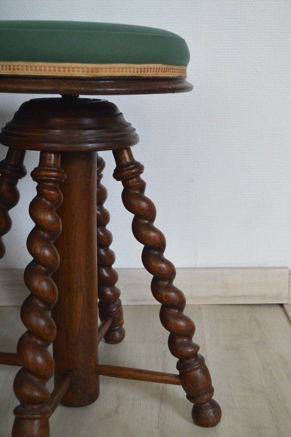 Antique piano stool with adjustable screws and turned wooden legs