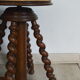 Antique piano stool with adjustable screws and turned wooden legs
