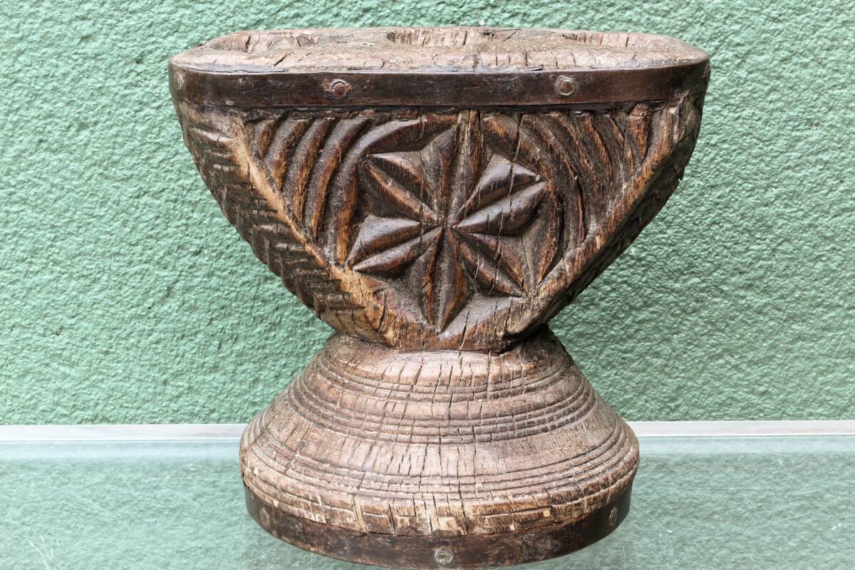 Brutalist candlestick, antique Asian grain sorter in carved wood.