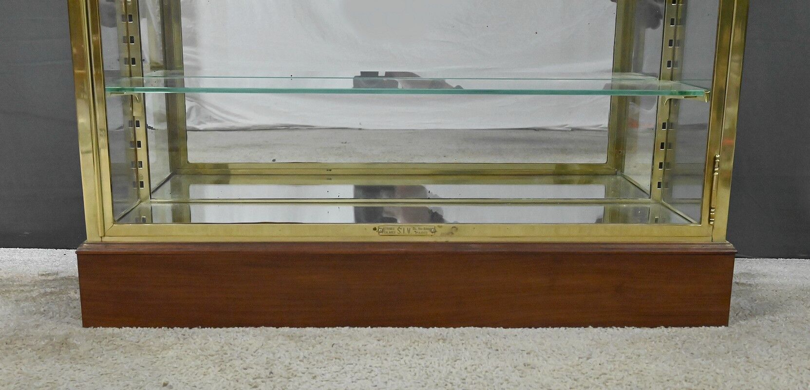 Brass display cabinet with a mirrored back – early 20th century