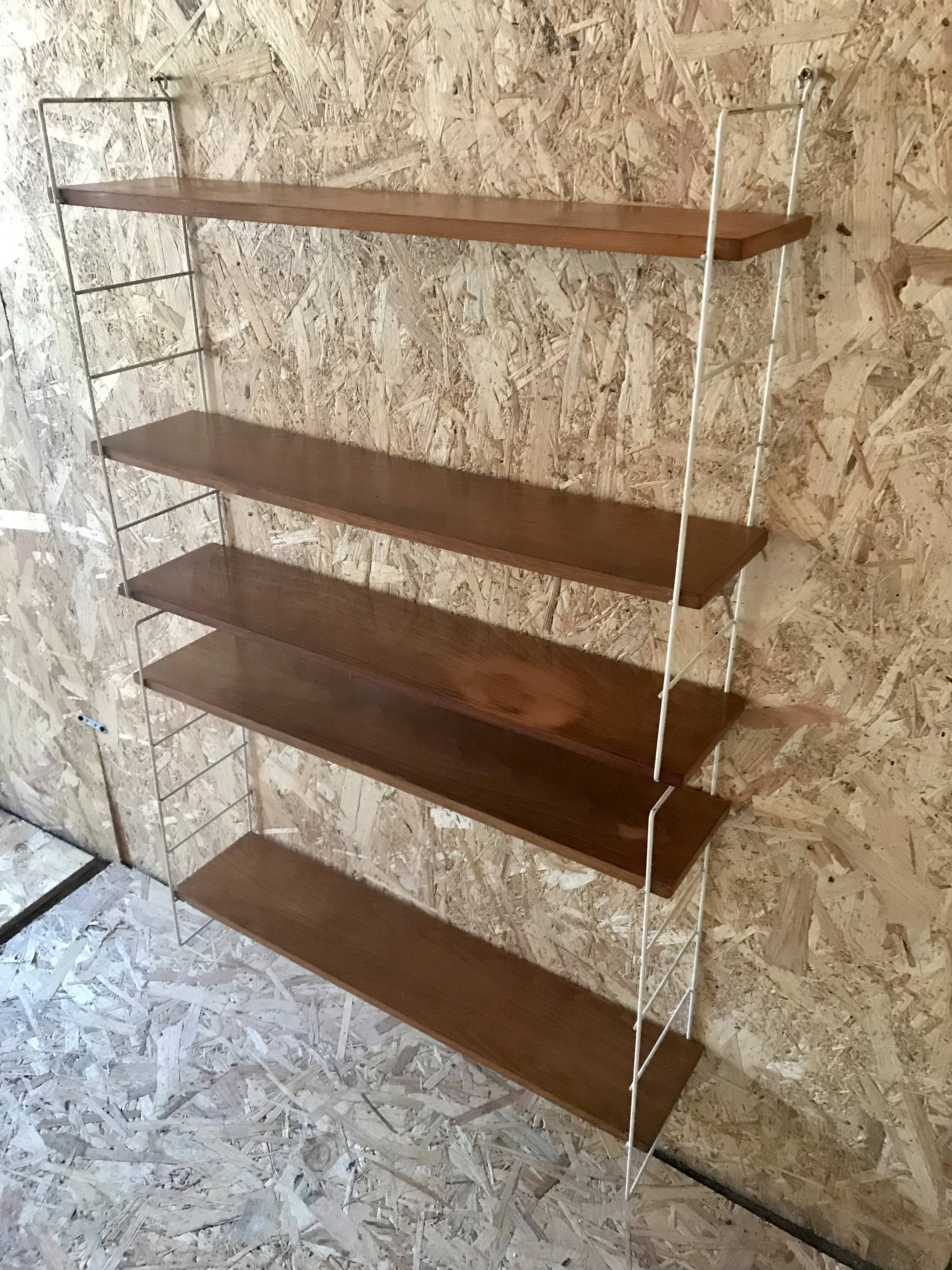 Vintage modular wall shelf with 4 supports and 5 levels.