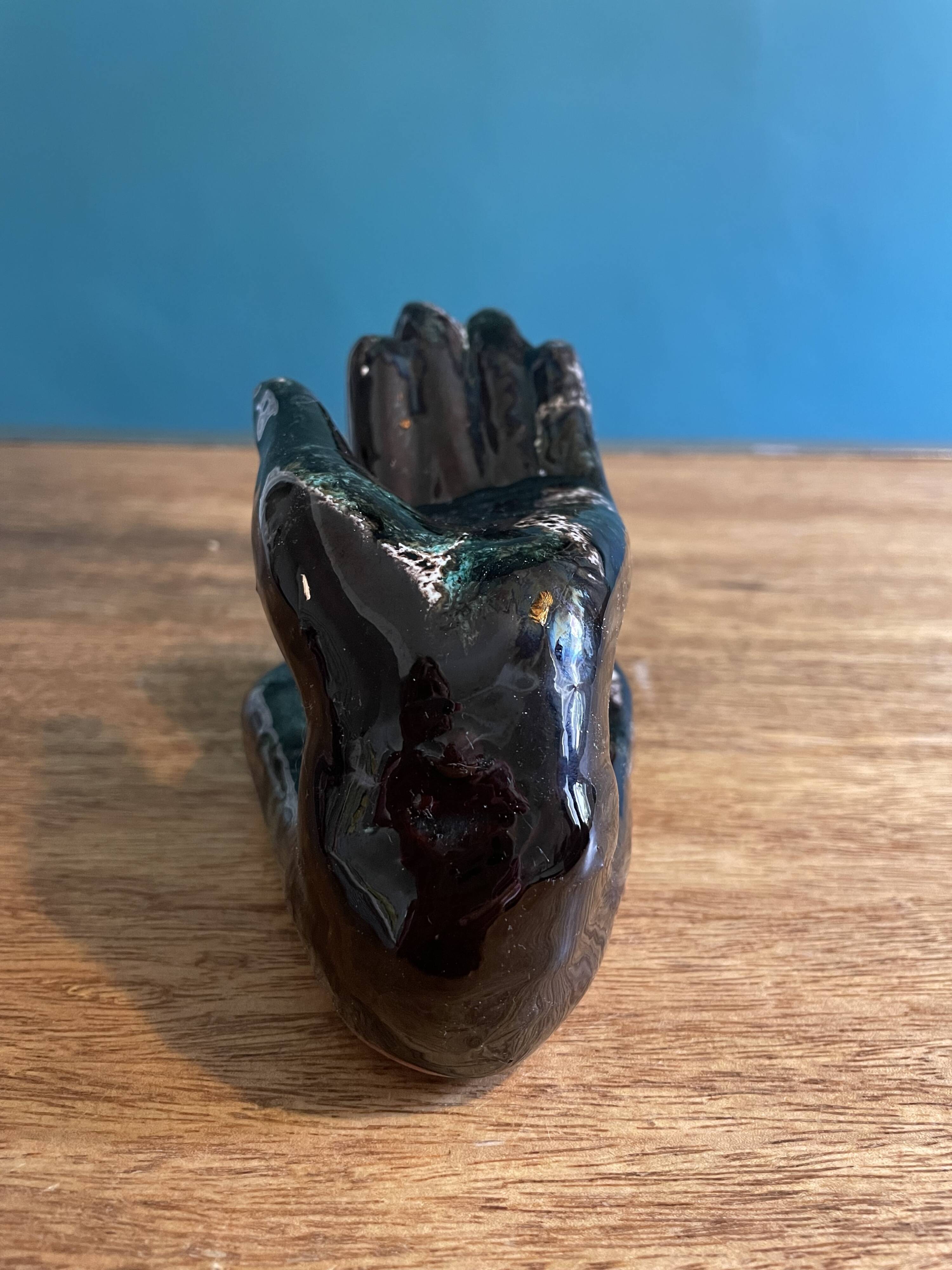 Hand-shaped coat hook