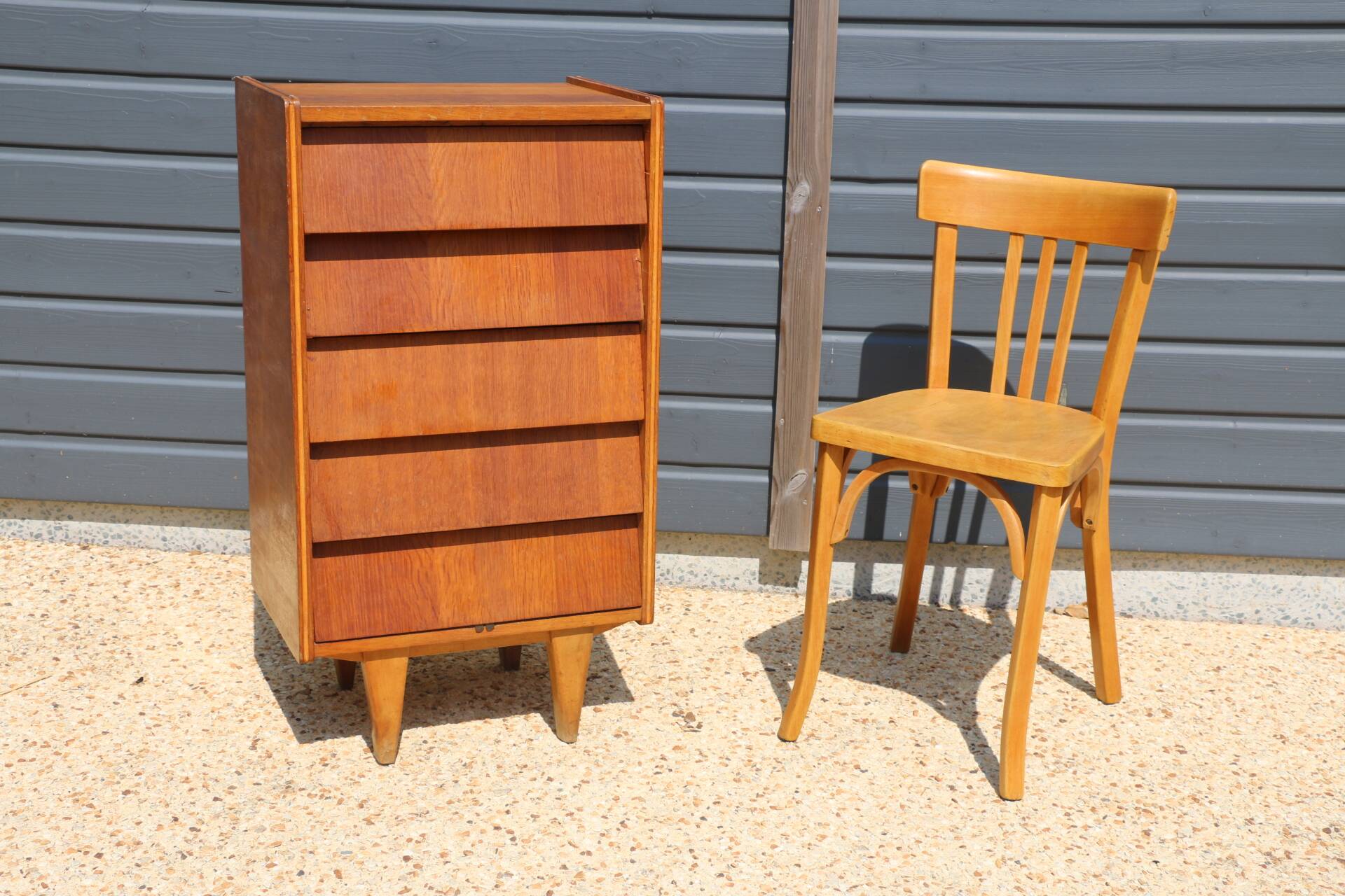 Dark chest of drawers with 5 drawers from the 1950s