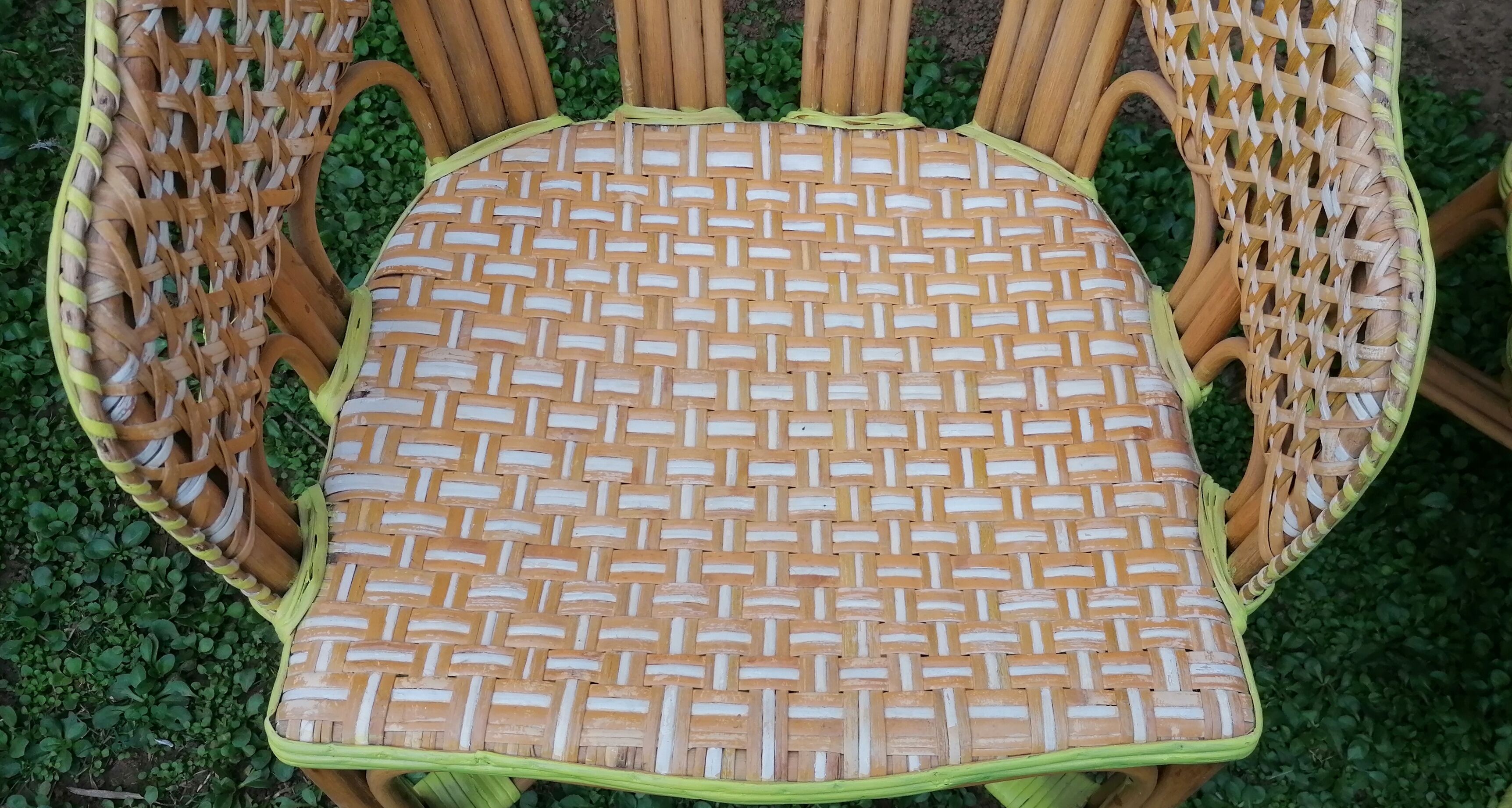 3 woven rattan armchairs