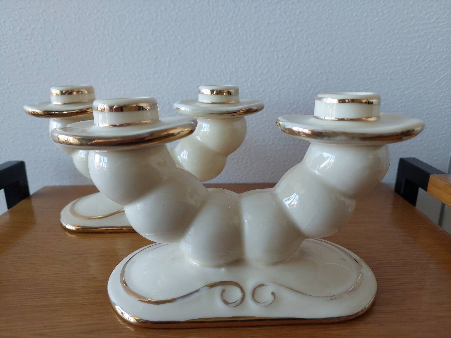 Pair of cream ceramic candlesticks with gold trim circa 1930-1950